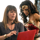 Patty Jenkins and Gal Gadot look at a laptop monitor on the set of Wonder Woman 1984.